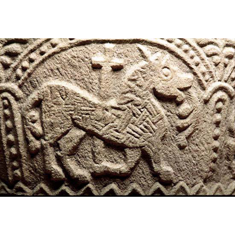 the quadruped here looks very much like the lions typical of Bestiarius, even with the acanthus-like tail and tongue; passant to the right