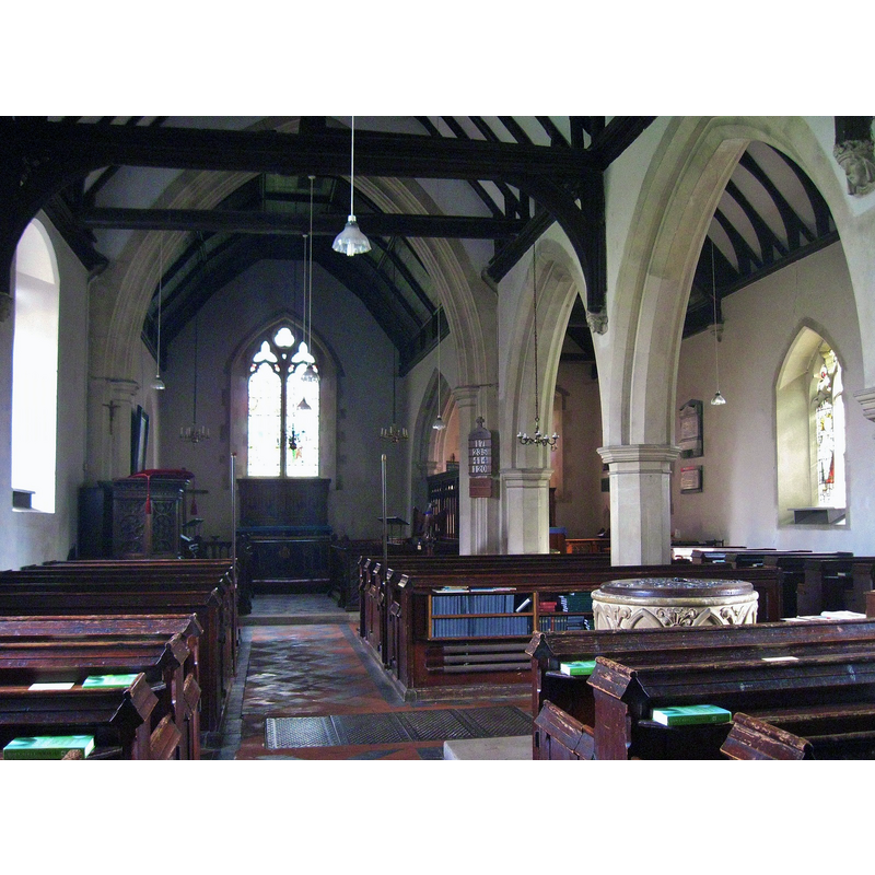 Source caption: "Interior of St. Peter's church, Goldhanger. Looking East along the nave and chancel originating in the eleventh century and showing the South aisle which was added in the fourteenth." -- the 19thC font partially visible in the nave