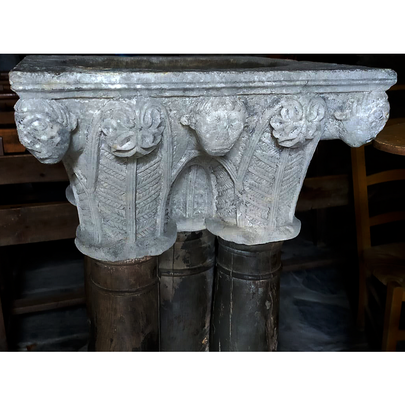 top and bottom are originally from the medieval cloister of the nearby priory of St-Orens en Lavedan; wooden columns added when the stoup was built in the 18thC