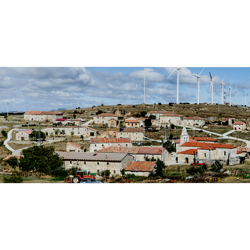 Source caption: "Acedillo. Panorámica amplia desde "El Castillo"" -- the church, with its 18thC belfry, is visible here in the bottom-right corner