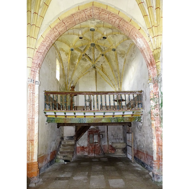 with the medieval font beneath the west gallery