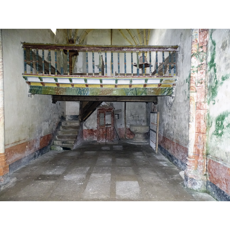 beneath the west gallery, north side