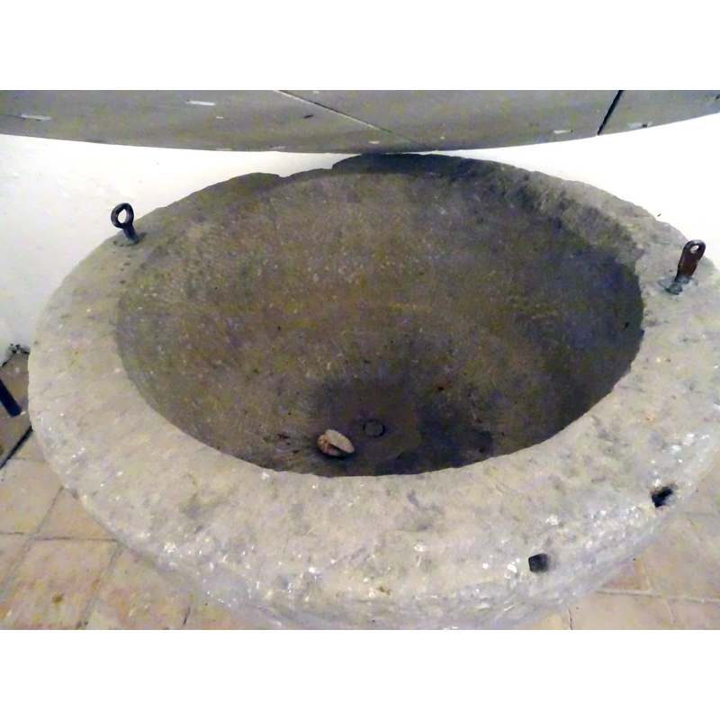 with a view of the centre drain, the metal staples and other details of the upper rim