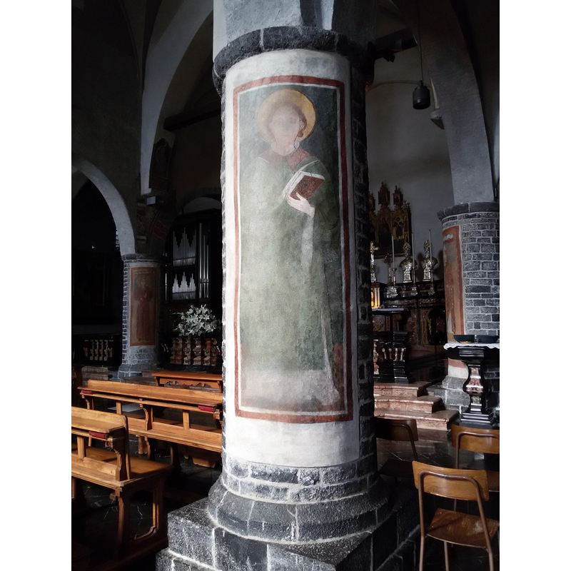 the modern baptismal font is partially visible here in the background, to the right of the large column