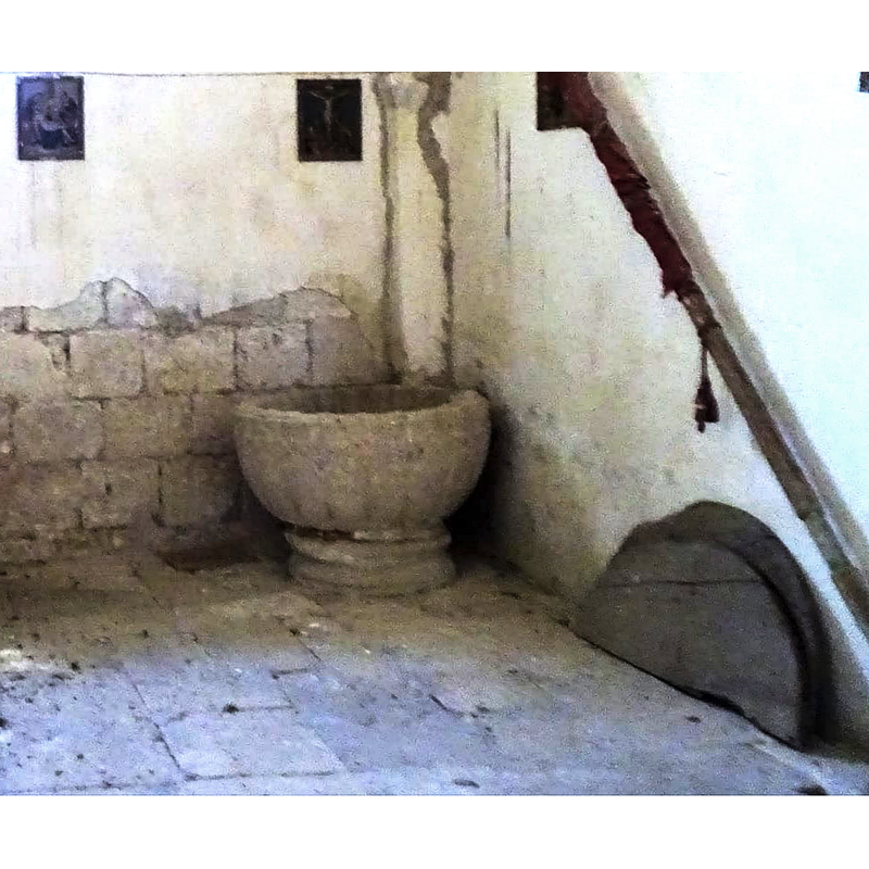 the two parts of the wooden cover are seen here on the ground, against the right [north] wall