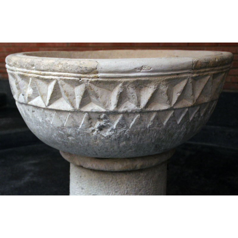 the lighter-colour repair to the upper rim is clearly visible here