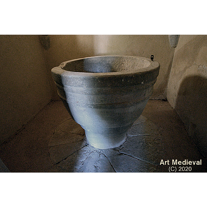 in 16thC north-side alcove now used as baptistery