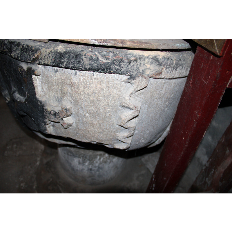 seen here to the right of the cross; damaged