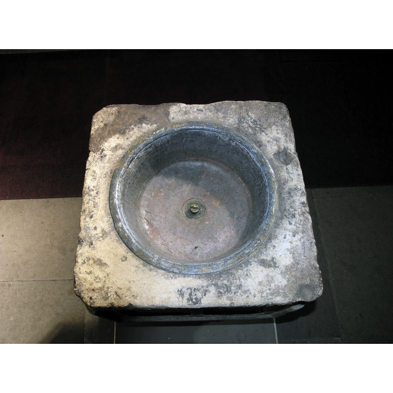 the lead-lined interior with a central drain