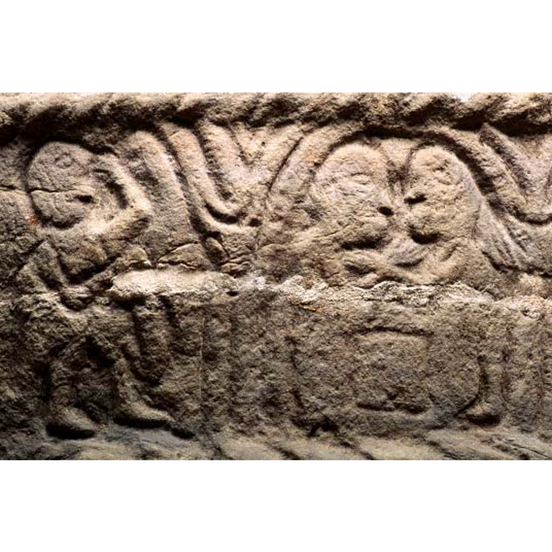 two huma figures appear to reach for each other across a table/altar? seen here in the right arch