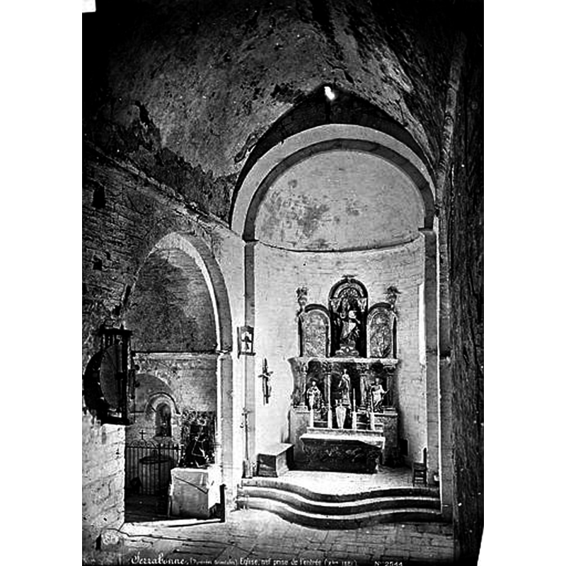 notice the baptismal font in its enclosure in the left chapel