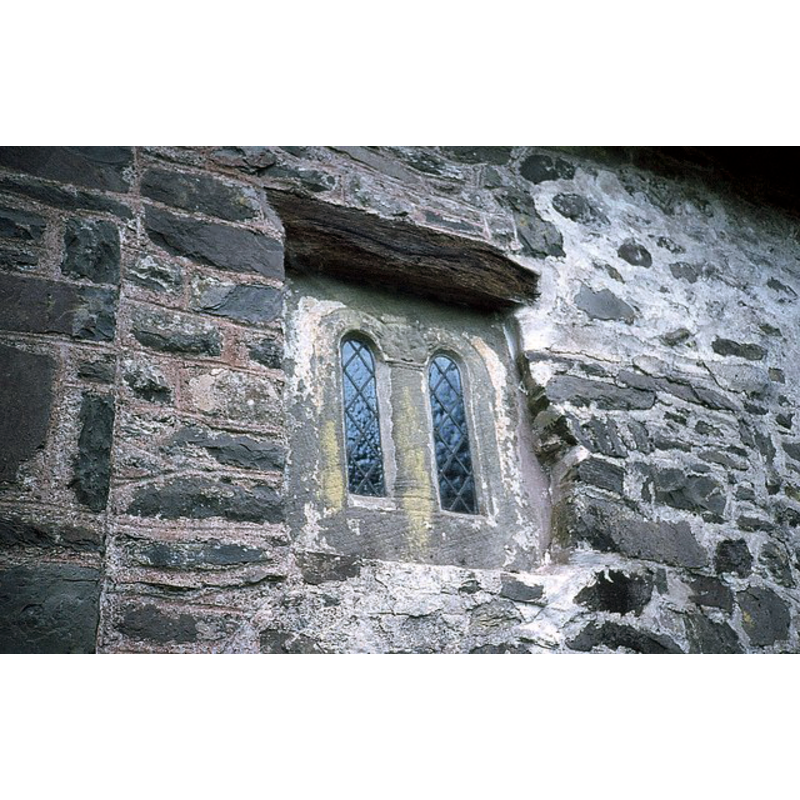 Source caption: "Saxon Window in Culbone Church. Saxon window in the chancel north wall - notice the 'Green Man' in the centre of the window. The Grade I listed Culbone Church is said to be the smallest parish church in England."