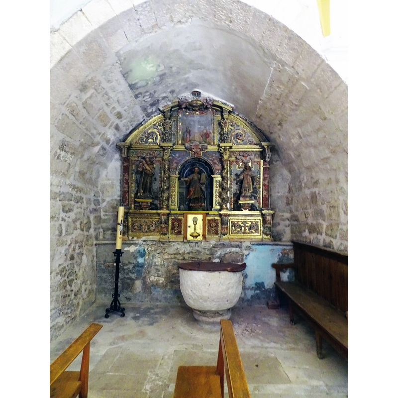 a chapel on the south side now housing the baptismal font