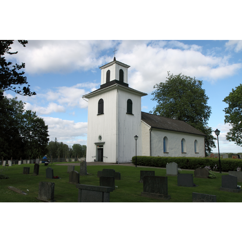 12thC church, much modified since; wooden tower of 1855