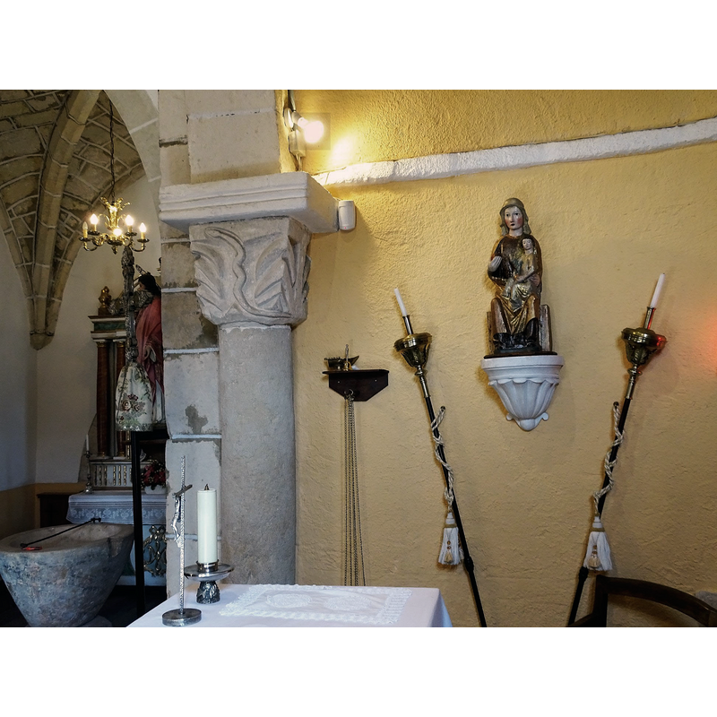 the font is partially visible here in the bottom left; to the right of the chancel arch capital that shows a serpent among foliage is a 14thC(?) statue of the Madonna and Child