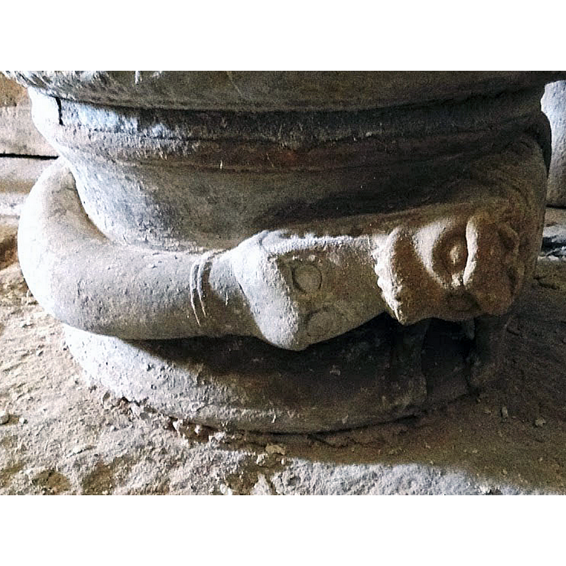 the head of the lion on the left bites the sbout of the snake on the left