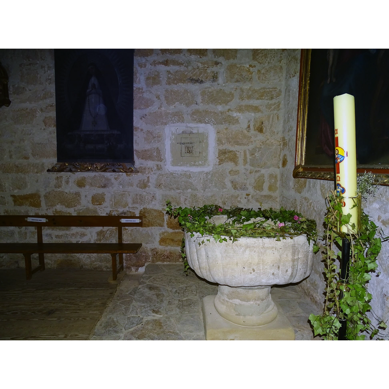 at the west end of the south aisle