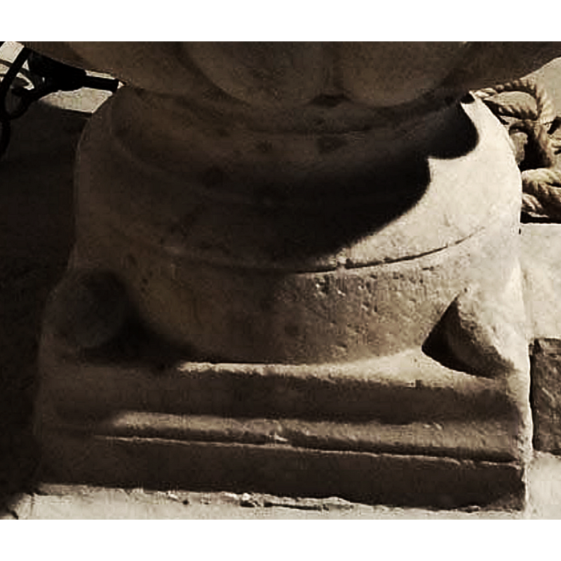 at the corners of the lower base; at least one is damaged