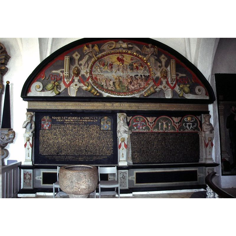 the medieval font stands now [2008] by the monument to Erik Ottesen and Otte Nielsen