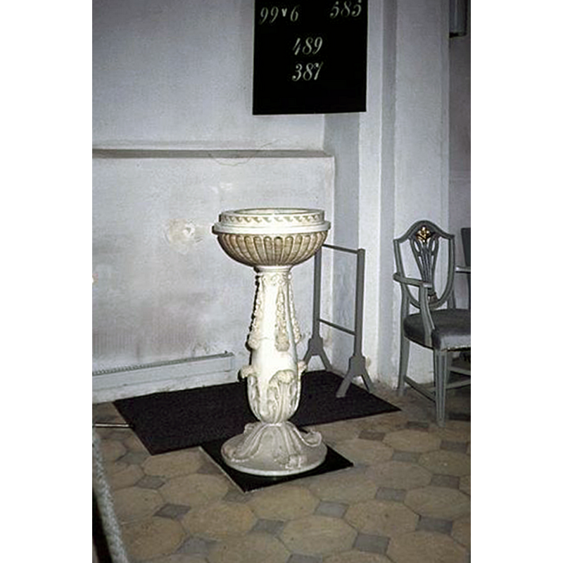 the modern font by Bertel Thorvaldsen in the northeast corner of the church