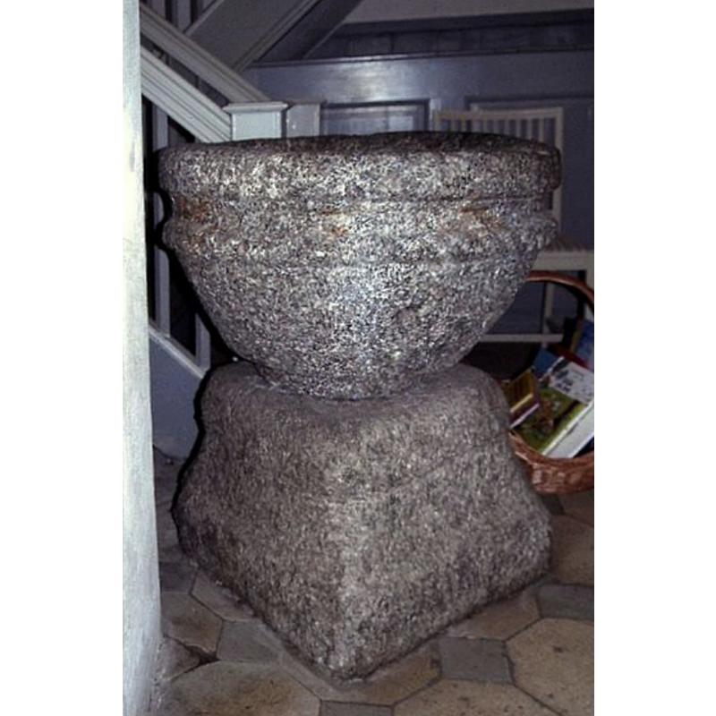 the medieval font by the gallery stairs