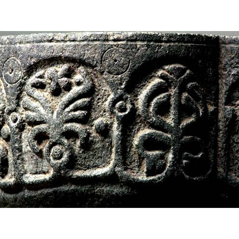 each one of a different design; the motif of the bead enclosed in a circle repeats itself, not just in the 'capitals' of the arcade