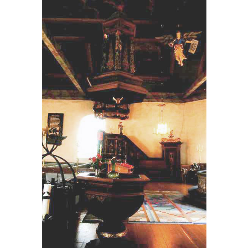 the 1698 font and its cover in the southeast corner of the church, opposite the pulpit