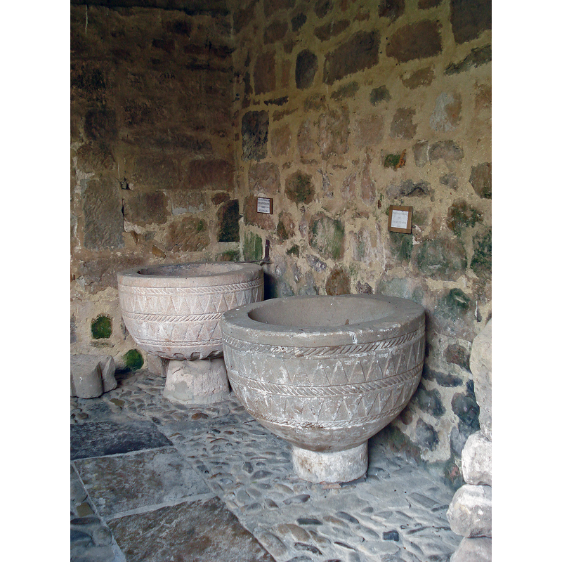 several medieval fonts from disappeared or disused paruish churches in the vecinity have been preserved in the cloitser of the collegiate church at Elines