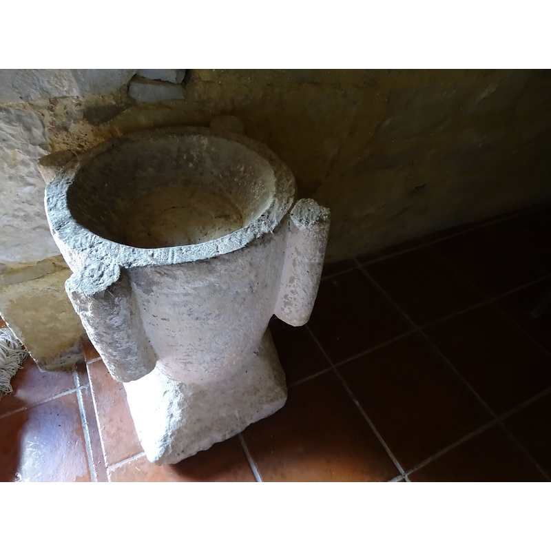 the stoup is shaped like an old grain mortar