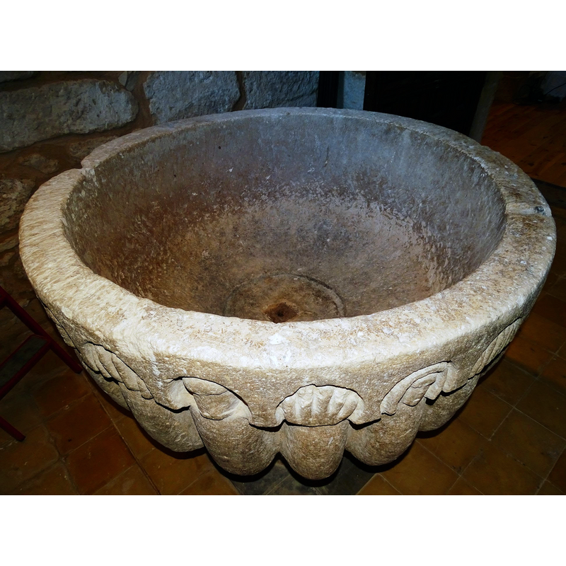 the damage to the upper rim on the left and, across from it, on the right, a notch cut to accommodate another piece of font cover anchoring