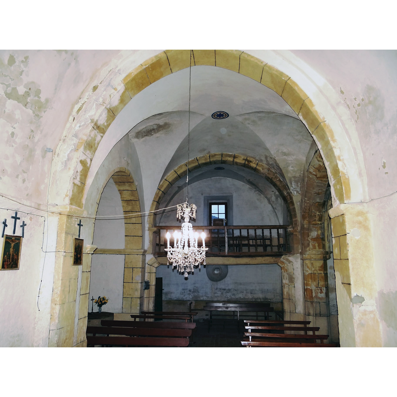 with a partial view of the font on the left [south] side, inside a chapel or alcove there