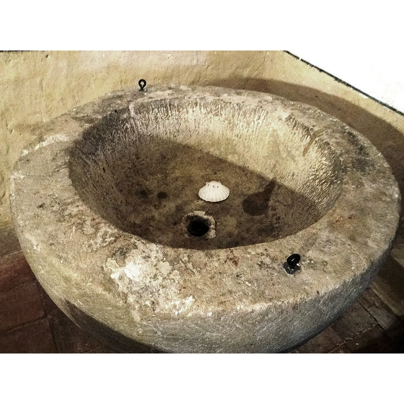 notice the two metal anchorings on the upper rim, and the central drain
