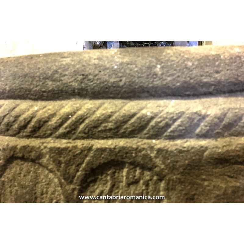 at the very rim, above the rope moulding