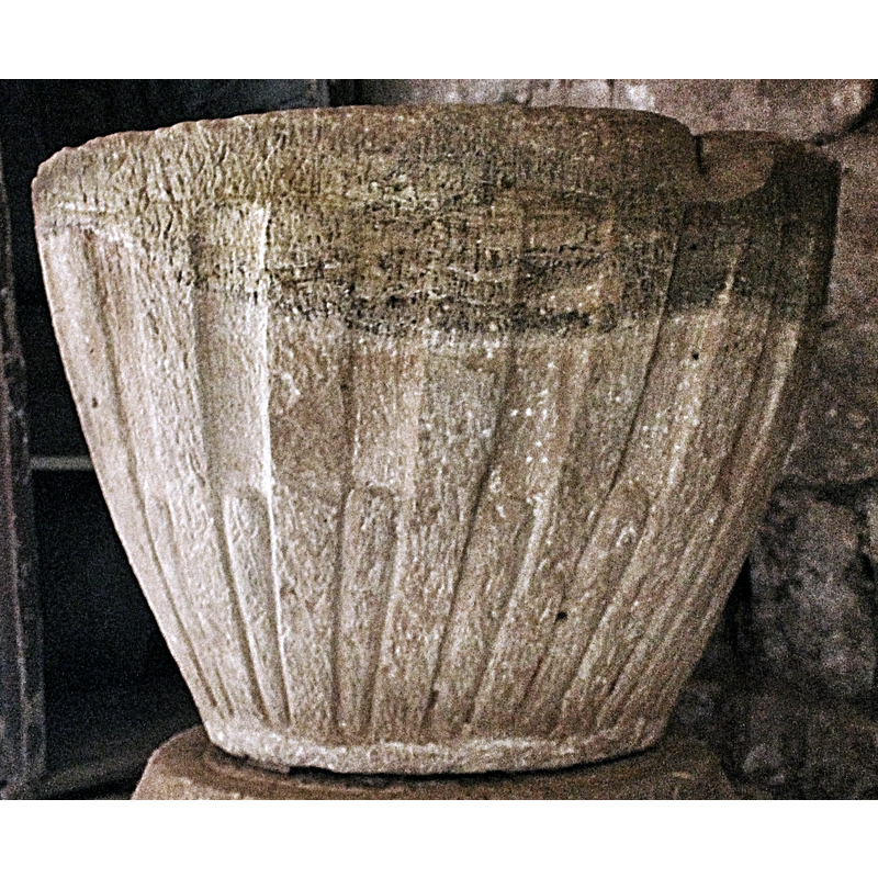 notice also the damage to the upper rim; it must have been caused by a metal anchoring from an old font splitting the stone