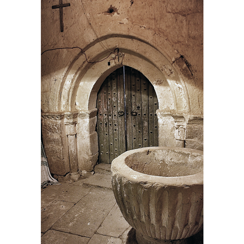 the 'baptistery' is a room fashioned out near the main portal, seen here behind the font