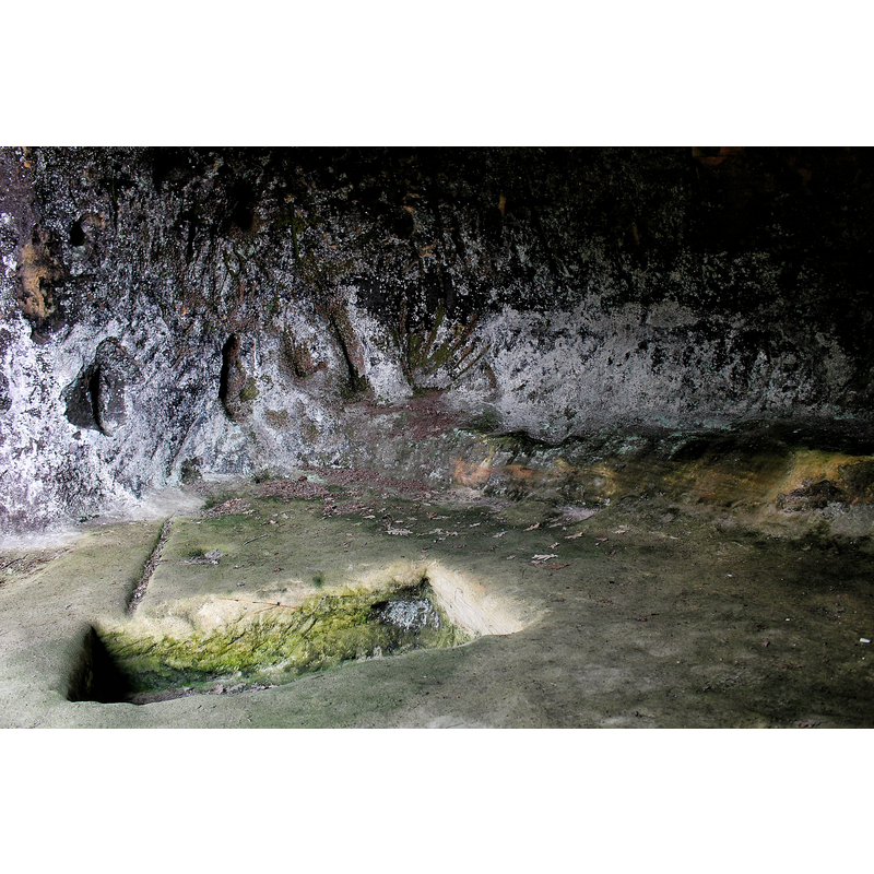 one of two quadrangular depressions in the ground of the Cueva de la Vieja; they have been described as possible baptismal fonts in some sources