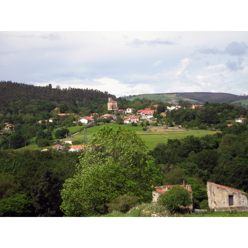 Source caption: "Vista de Rucandio desde La Lombana (Cantabria, España)" -- the parish church seen here on a height in the centre of the image