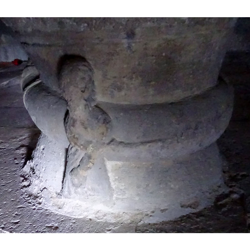 the knight on the left takes his sowrd to the thick body of the snake