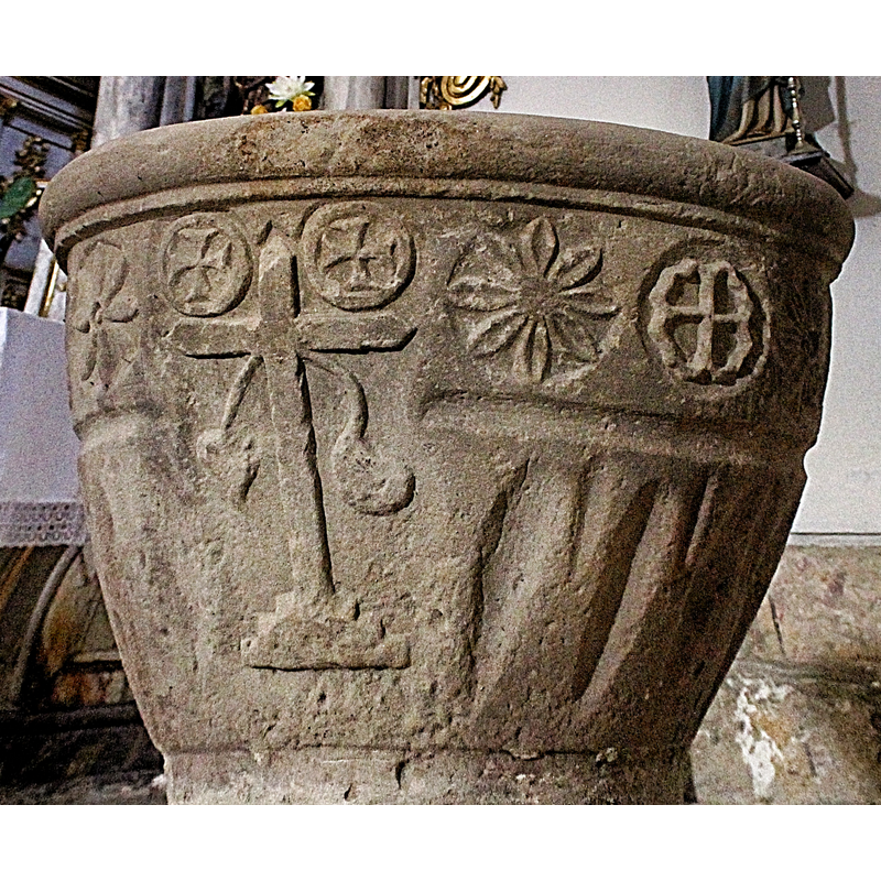seen here at the far right, after the rosette motif, to the right of the Latin cross