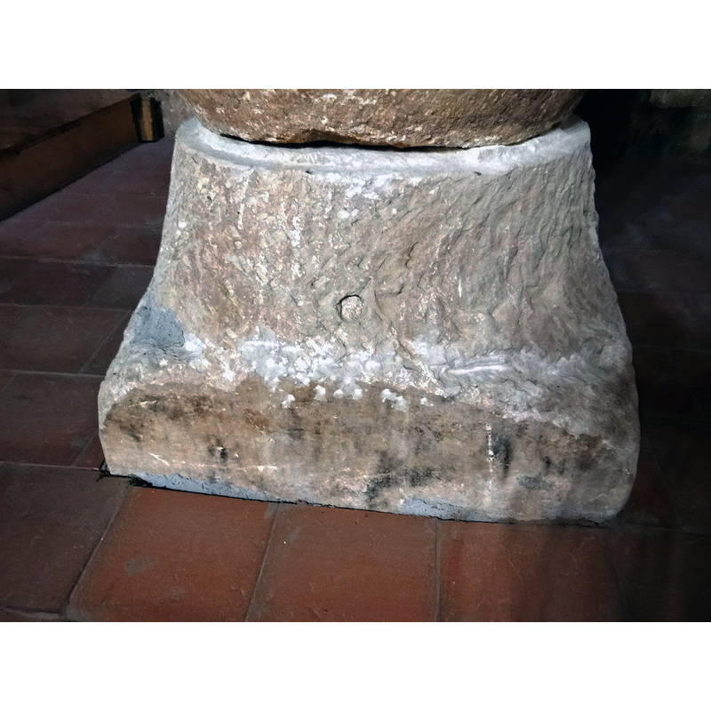 notice that the lower end is partly buried in the flooring