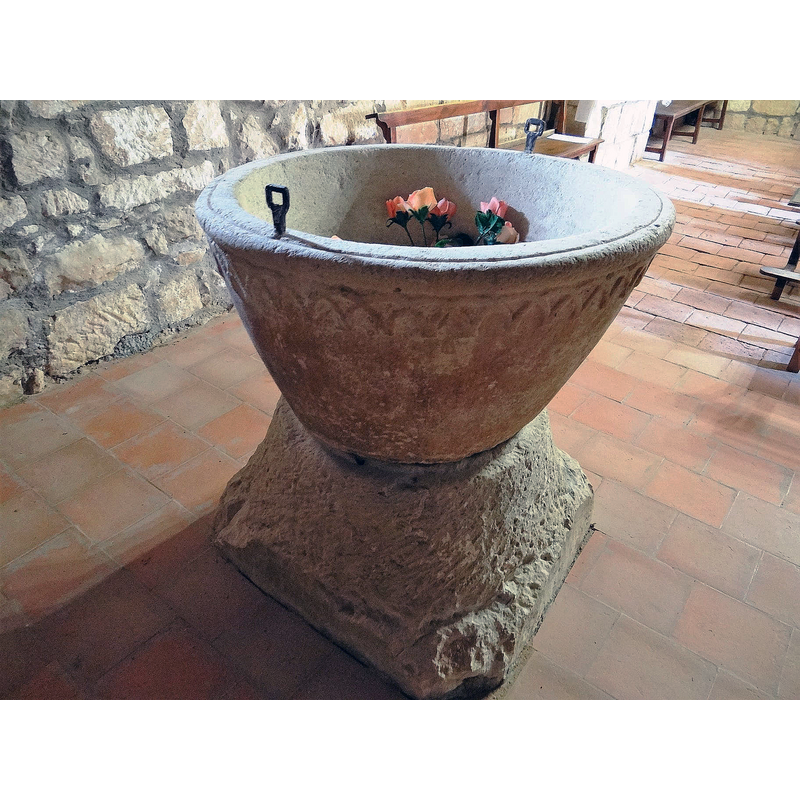 the font photographed ca. 2021 back in its original location at the west end, beneath the gallery, north side