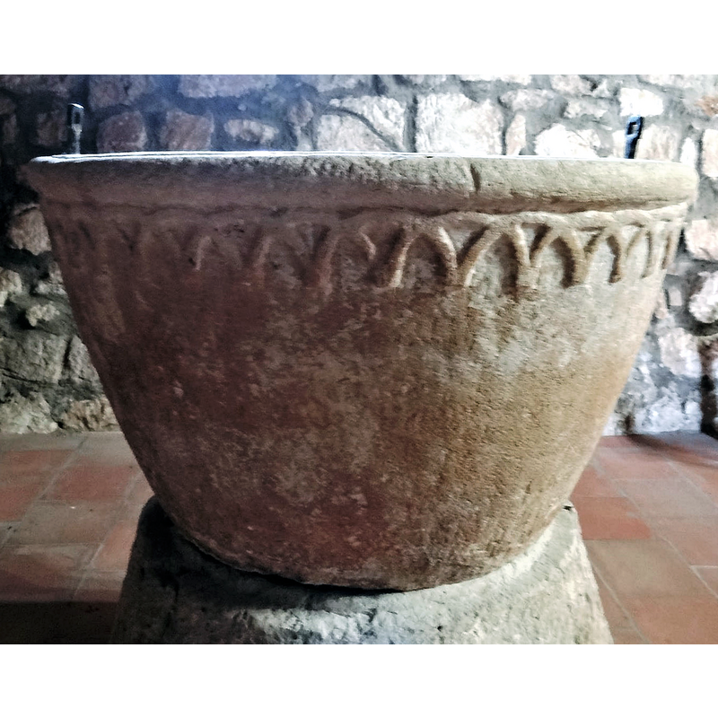 the font photographed ca. 2021 back in its original location at the west end, beneath the gallery, north side