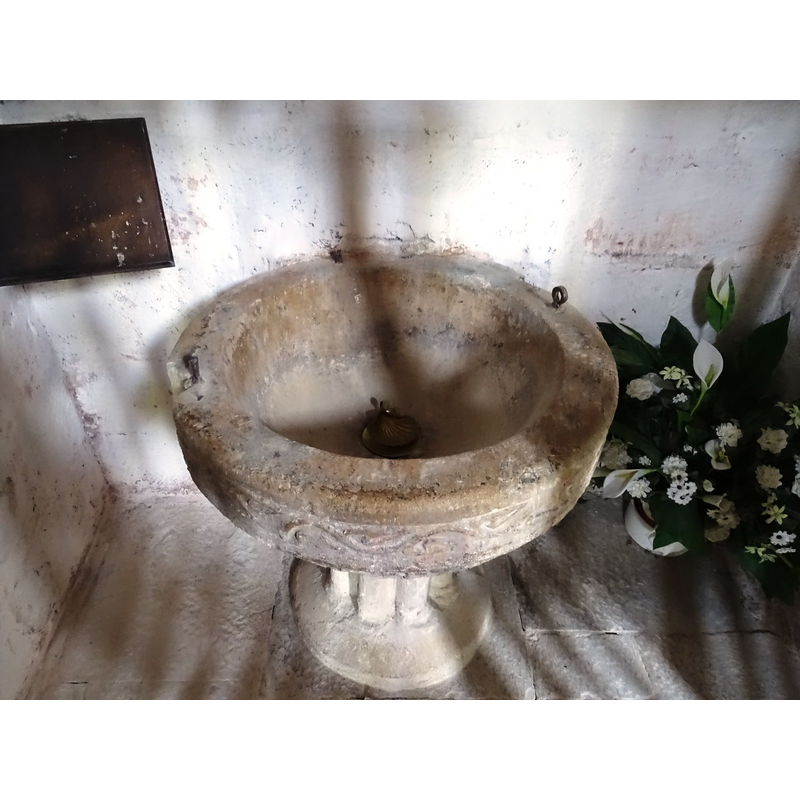 notice the two metal staples in the upper rim; also, the back of the basin is cemented to the wall