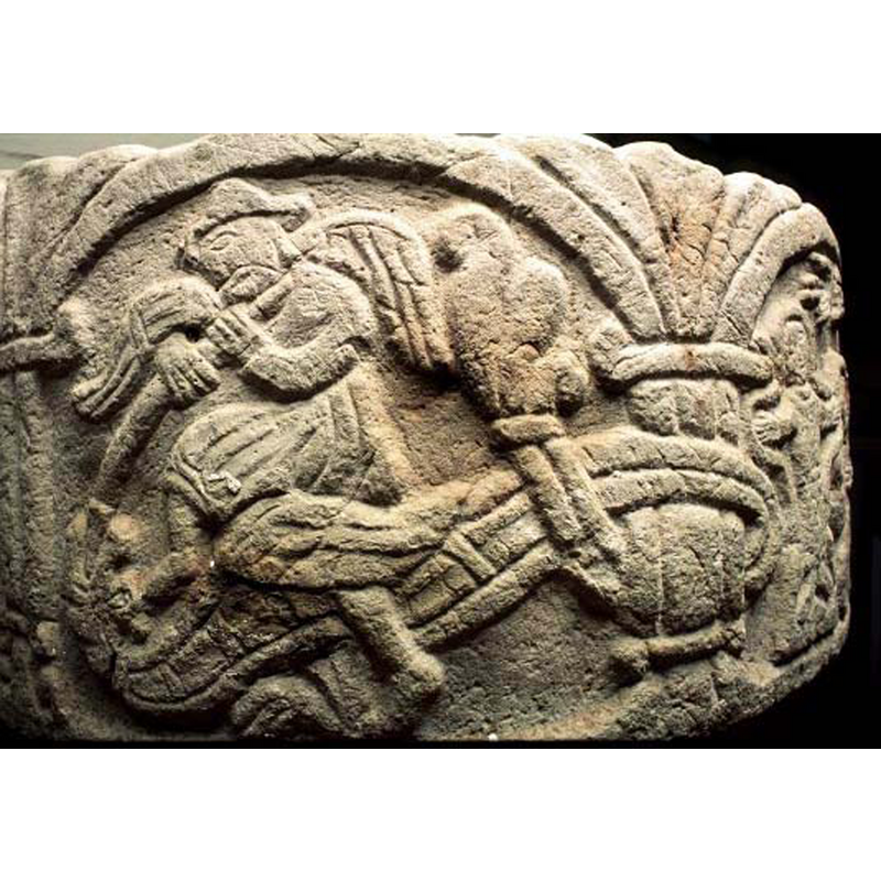a very dynamic rendering of the legend; Michael thrusts the spear into the dragon's mouth as he steps on the beast, whose tail coils around the pillar on the left -- notice the patterns on the dragon's body and the fantastic acanthus-leaf tail end
