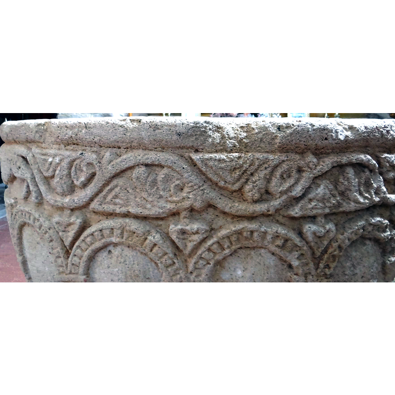 of triangular shape in every spandrel of the arcade