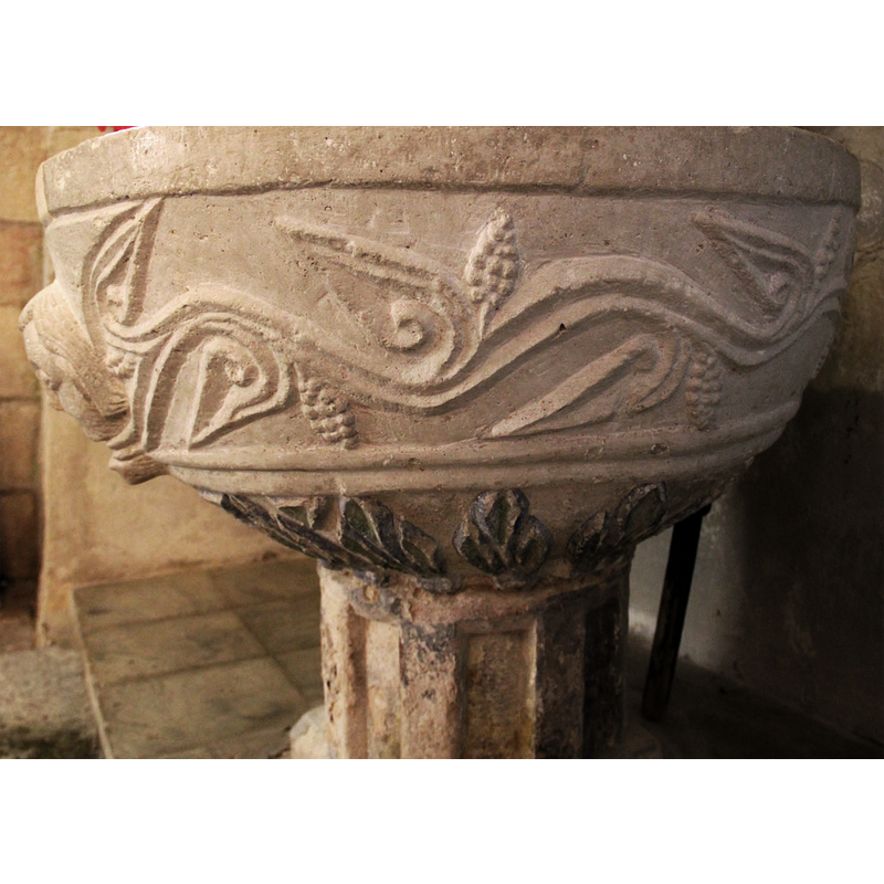 stemming from the head and running all around the basin; these on the right of the human head issuing them
