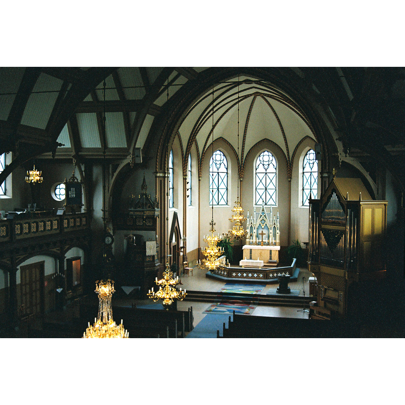 the medieval font is visible on the chancel, right [south] side