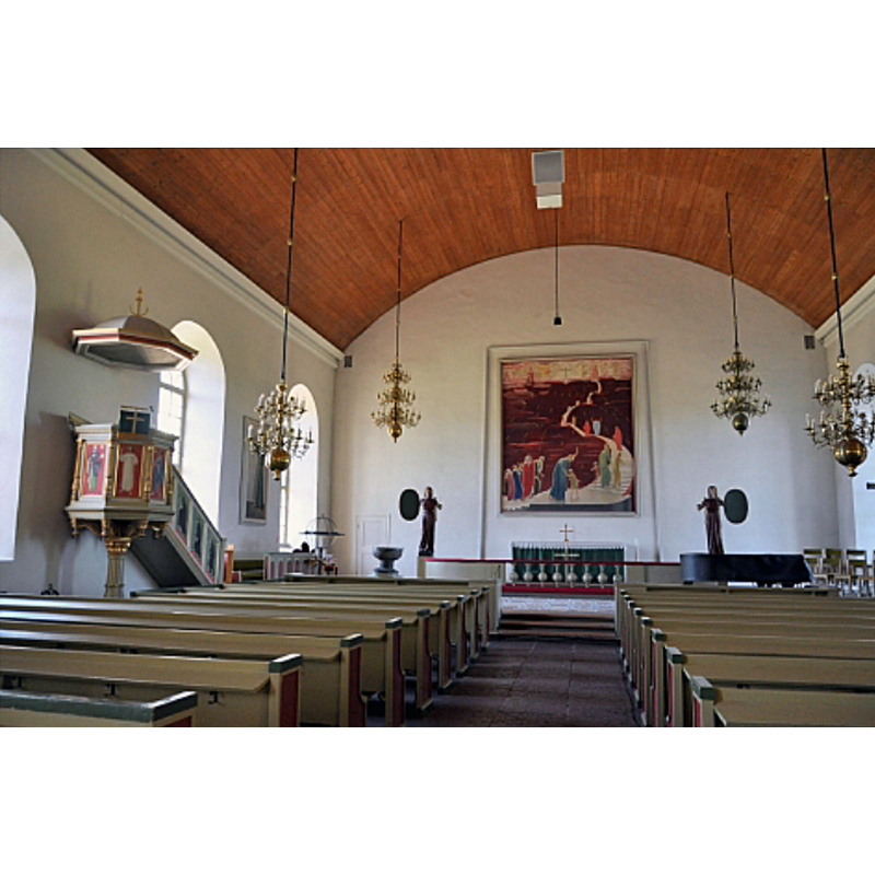 showing the medieval font in the northeast corner, to the left of the communion railing