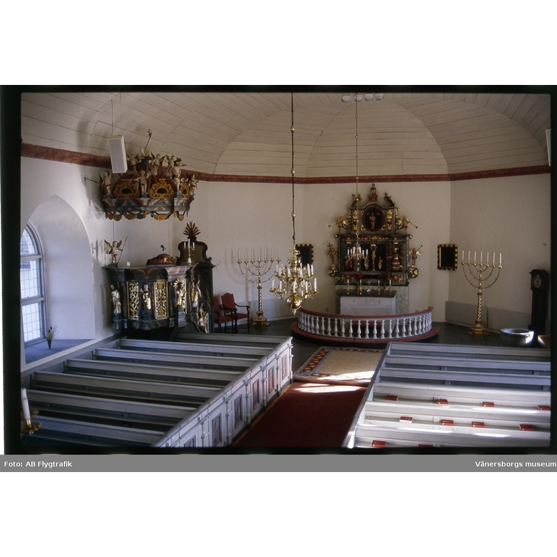 showing the medieval baptismal font in the southeast corner