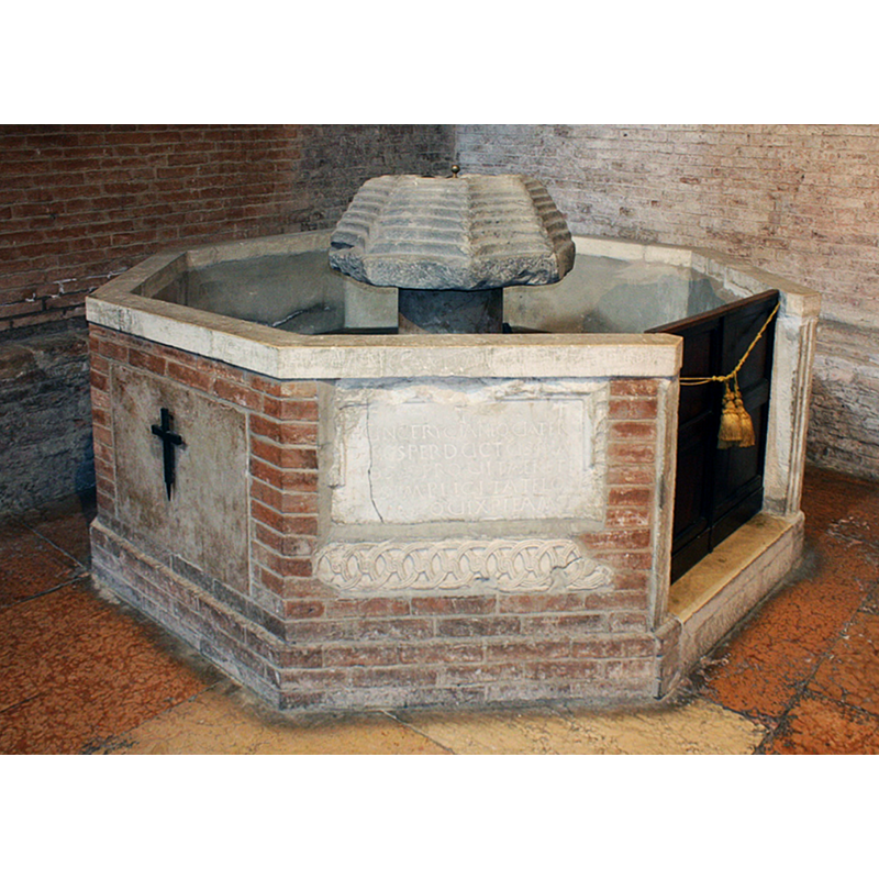 described and illustrated in La Basilica Abbaziale [https://abbazianonantola.it/visita-abbazia] [accessed 25 April 2021] as an octagonal composite object cobbled together in the 20th century; it indludes fragments of a Romanesque frieze, an inscribed palaeo-Christian grave stone and a Roman water fountain in its centre [="Il fonte battesimale, alla sinistra del portale, di forma ottagonale, è frutto di un rifacimento di inizio Novecento. Murati nella struttura vi sono frammenti di un fregio romanico e una lapide che ricorda una sepoltura paleocristiana. All’interno il fonte battesimale è stato ricavato reimpiegando una fontana romana."]